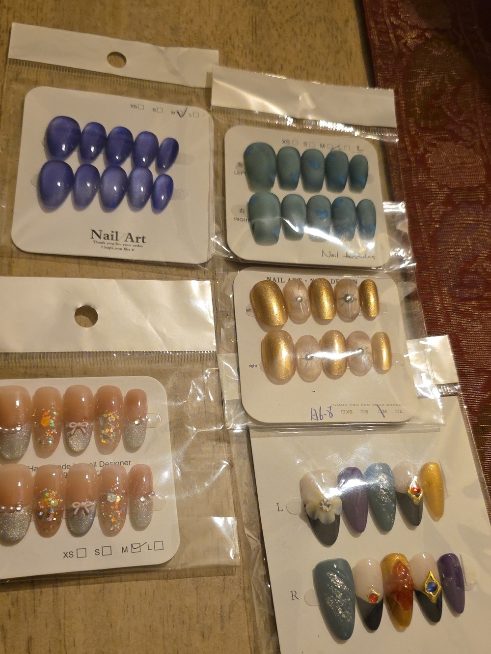 Assorted Press-On Nail Sets — Blue, Teal, Gold, Nude, Purple Med